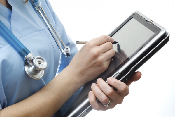 Doctor is using tablet pc